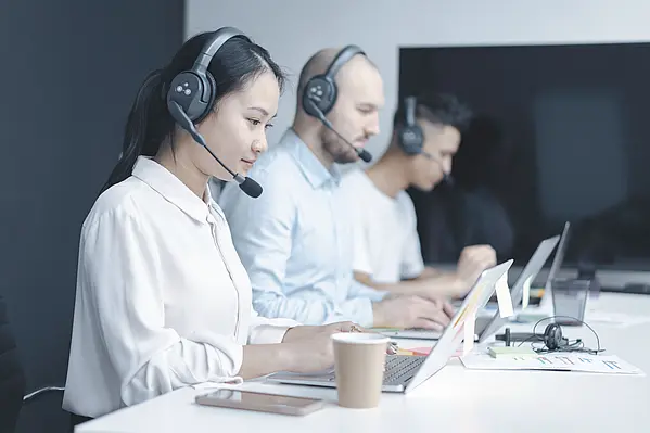 Contact center team using ASC technologies voice recording and quality management tools to analyze customer interactions