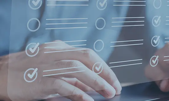 Hand typing on laptop keyboard with overlaid checklist icons – representing automated quality management